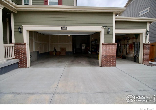 garage with concrete driveway