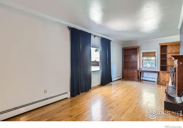 unfurnished living room featuring a baseboard heating unit, ornamental molding, baseboard heating, and light wood-style flooring