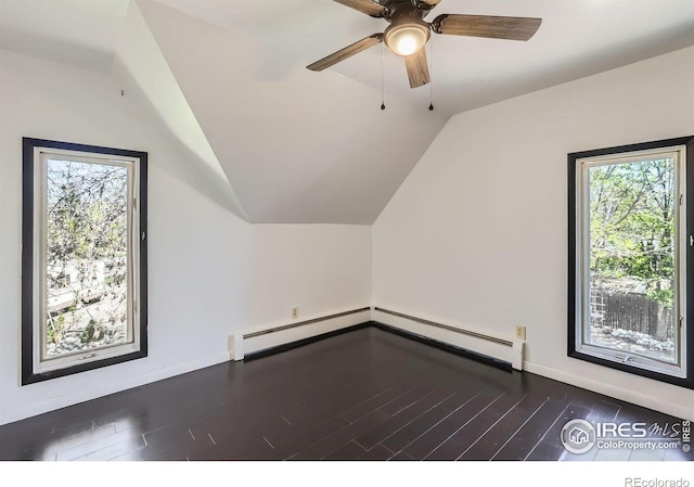 bonus room with a wealth of natural light, lofted ceiling, and wood finished floors