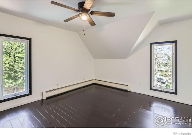 bonus room with wood finished floors, baseboards, ceiling fan, a baseboard radiator, and vaulted ceiling