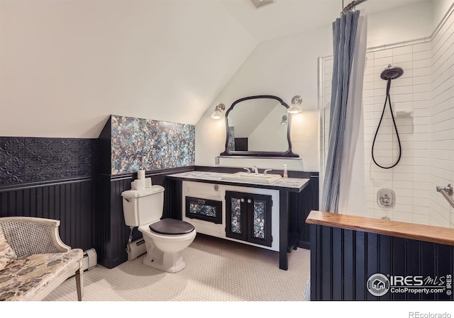 full bathroom featuring vanity, toilet, a shower with shower curtain, lofted ceiling, and a baseboard radiator