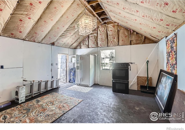 interior space with a healthy amount of sunlight and lofted ceiling