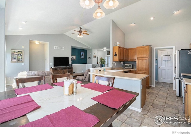 dining room featuring ceiling fan, visible vents, high vaulted ceiling, and a toaster