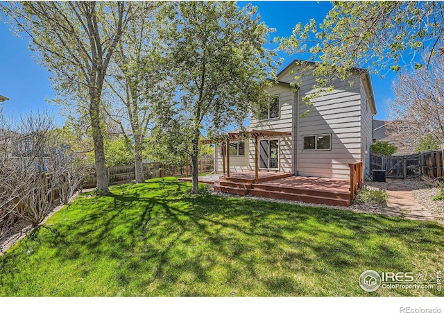 1507 Begonia Way, Superior, CO 80027 - rear view of house with a yard, central AC unit, a wooden deck, and a fenced backyard