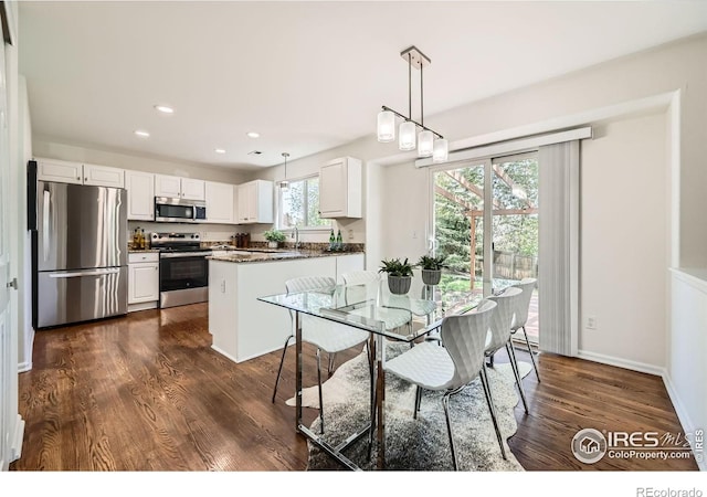 1507 Begonia Way, Superior, CO 80027 - dining area with recessed lighting, dark wood-style flooring, and baseboards