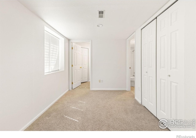 1507 Begonia Way, Superior, CO 80027 - unfurnished bedroom with carpet flooring, baseboards, and a closet