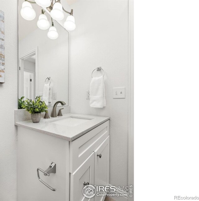 1507 Begonia Way, Superior, CO 80027 - bathroom featuring vanity and an inviting chandelier