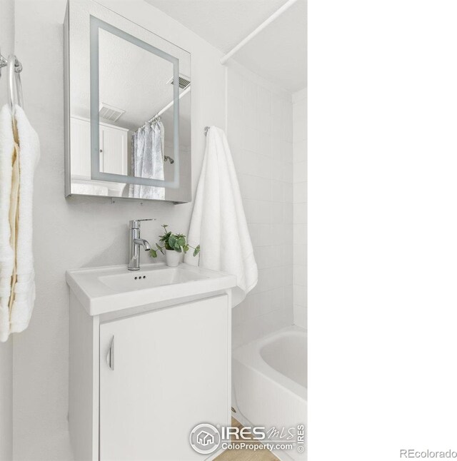 1507 Begonia Way, Superior, CO 80027 - bathroom featuring vanity, shower / tub combo, and visible vents