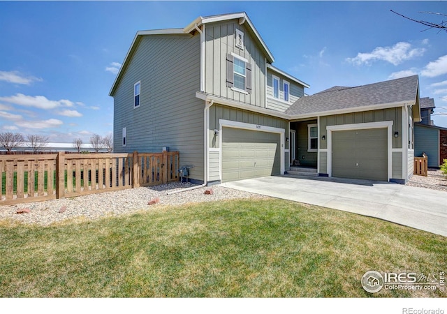 view of front of home featuring fence, a front yard, roof with shingles, board and batten siding, and driveway
