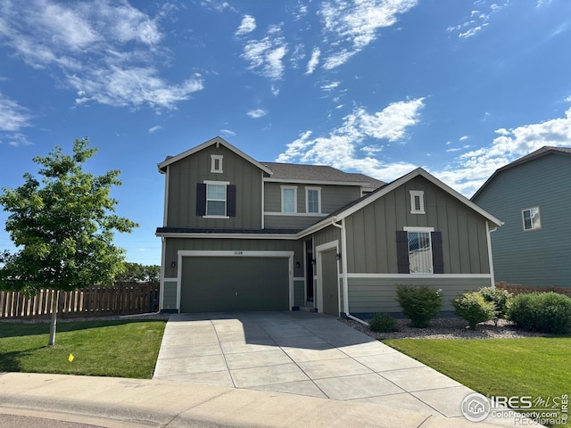 5128 Odessa Lake St, Timnath, CO 80547 - view of front facade with board and batten siding, concrete driveway, and an attached garage