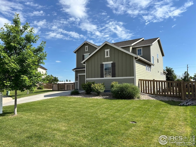 5128 Odessa Lake St, Timnath, CO 80547 - view of front of house featuring board and batten siding and driveway
