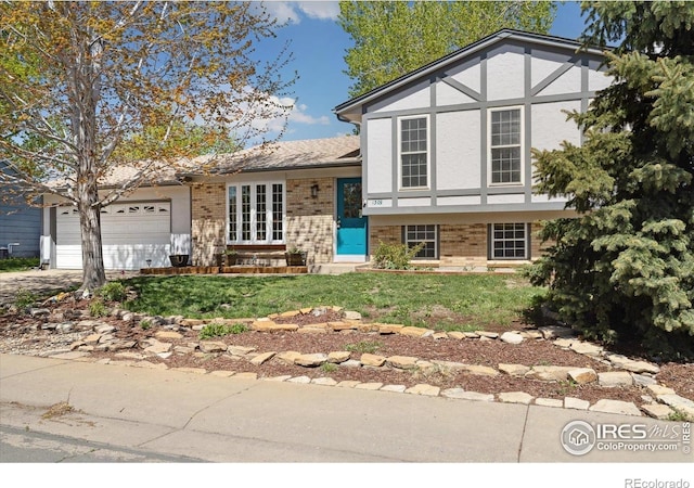 1309 Alexandria St, Lafayette, CO 80026 - view of front of house with brick siding, concrete driveway, a garage, and a front yard