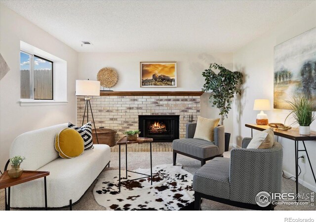 1309 Alexandria St, Lafayette, CO 80026 - living room featuring carpet floors, a fireplace, a textured ceiling, and baseboards
