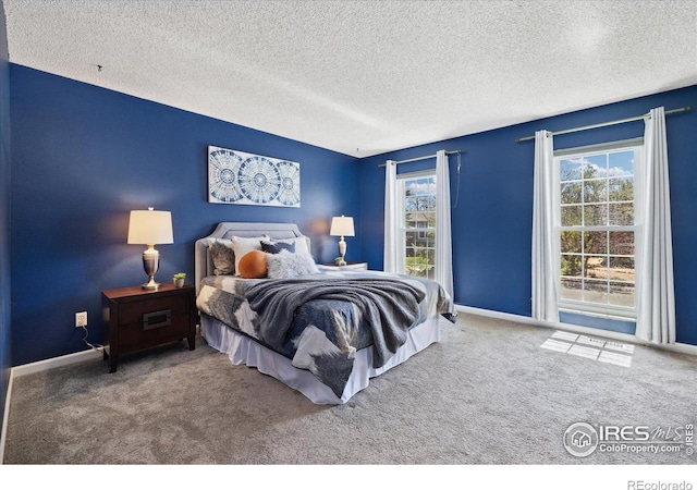 1309 Alexandria St, Lafayette, CO 80026 - carpeted bedroom featuring a textured ceiling and baseboards