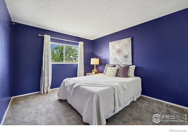 1309 Alexandria St, Lafayette, CO 80026 - bedroom featuring carpet flooring, baseboards, and a textured ceiling