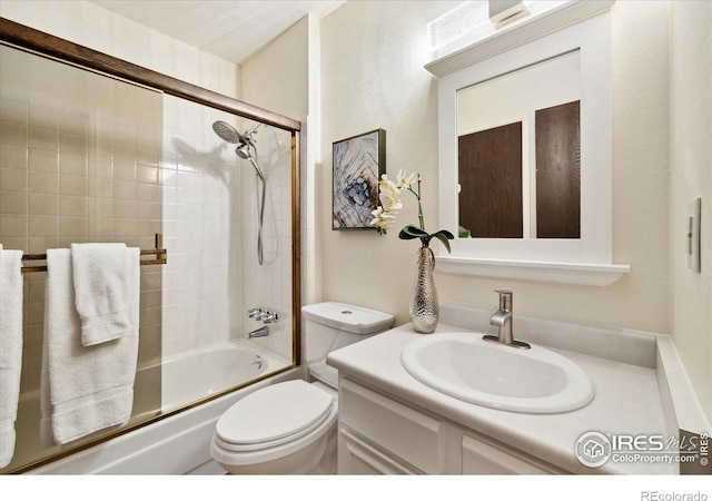 1309 Alexandria St, Lafayette, CO 80026 - bathroom featuring bath / shower combo with glass door, vanity, and toilet