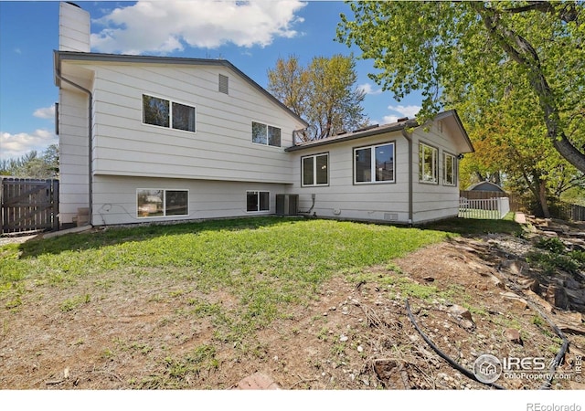 1309 Alexandria St, Lafayette, CO 80026 - back of house featuring a chimney and cooling unit