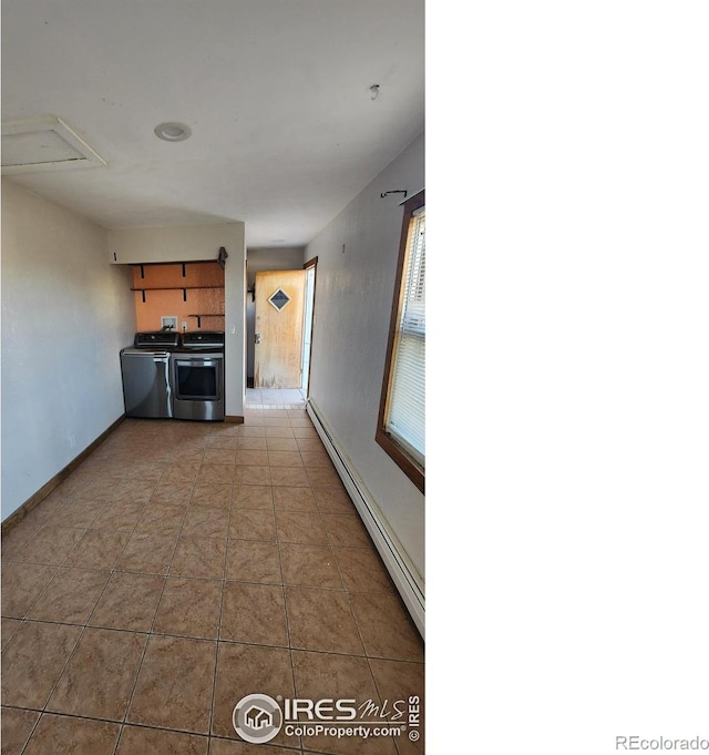 17233 County Road 16, Atwood, CO 80722 - hallway with baseboards, a baseboard radiator, and washer and clothes dryer