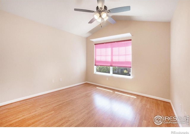 5225 White Willow Dr Unit 210, Fort Collins, CO 80528 - spare room with a ceiling fan, baseboards, vaulted ceiling, and wood finished floors