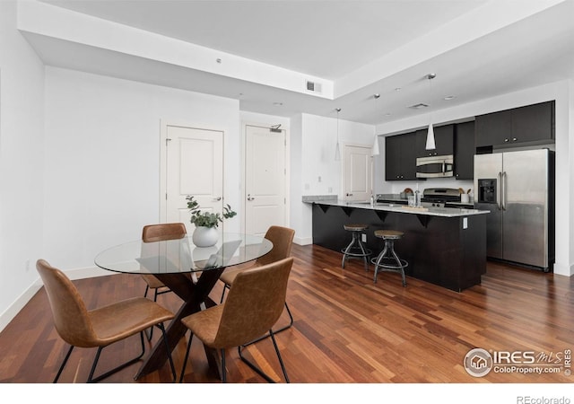 2001 Lincoln St Unit 2113, Denver, CO 80202 - dining space featuring dark wood-style floors and baseboards