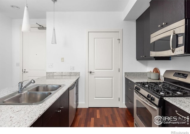 2001 Lincoln St Unit 2113, Denver, CO 80202 - kitchen featuring stainless steel appliances, dark wood-style floors, and pendant lighting