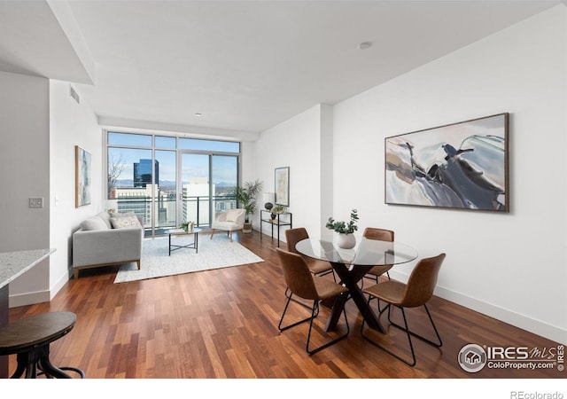 2001 Lincoln St Unit 2113, Denver, CO 80202 - dining area with expansive windows and wood finished floors