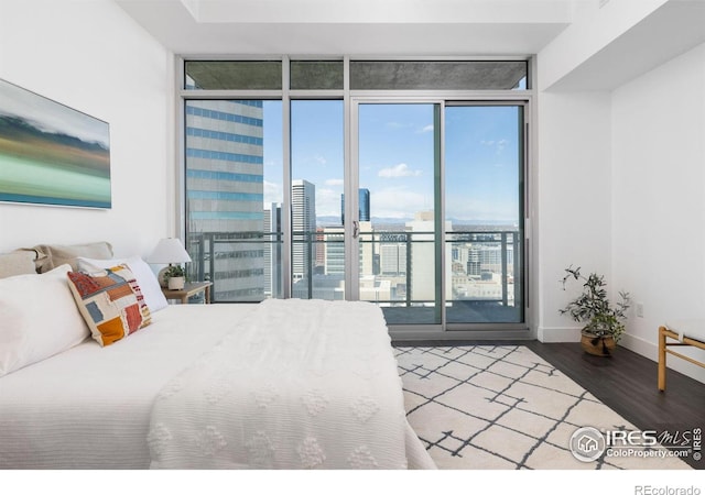 2001 Lincoln St Unit 2113, Denver, CO 80202 - bedroom with floor to ceiling windows, access to exterior, wood finished floors, and a view of city