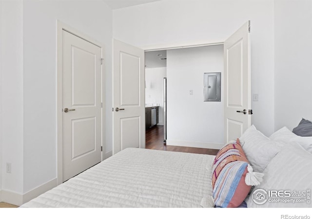 2001 Lincoln St Unit 2113, Denver, CO 80202 - bedroom featuring electric panel and wood finished floors
