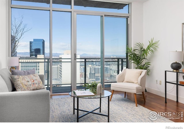 2001 Lincoln St Unit 2113, Denver, CO 80202 - living room featuring wood finished floors, floor to ceiling windows, and a city view