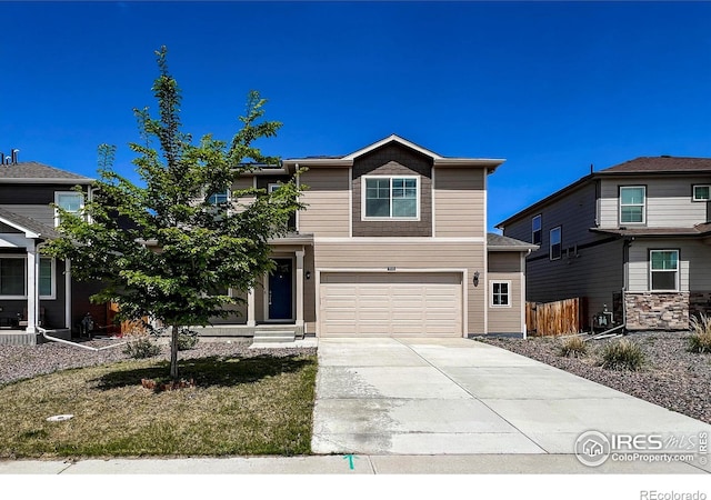 2325 Mountain Sky Dr, Fort Lupton, CO 80621 - view of front of house with driveway and a garage