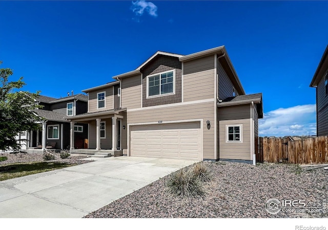 2325 Mountain Sky Dr, Fort Lupton, CO 80621 - view of front of house featuring covered porch, an attached garage, and driveway