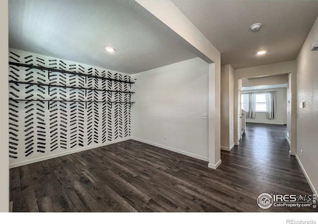 2325 Mountain Sky Dr, Fort Lupton, CO 80621 - empty room with dark wood-style flooring, baseboards, a smoke detector, and recessed lighting