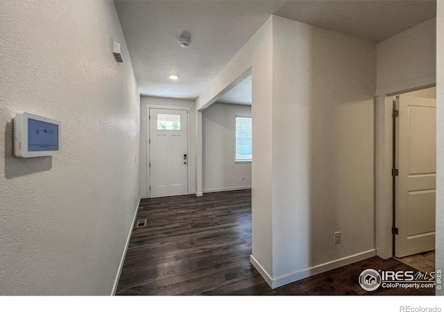 2325 Mountain Sky Dr, Fort Lupton, CO 80621 - hall featuring baseboards, wood finished floors, and a textured wall