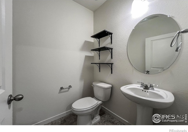 2325 Mountain Sky Dr, Fort Lupton, CO 80621 - half bath with toilet and baseboards