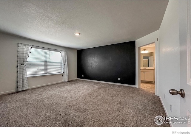 2325 Mountain Sky Dr, Fort Lupton, CO 80621 - carpeted spare room with baseboards and a textured ceiling