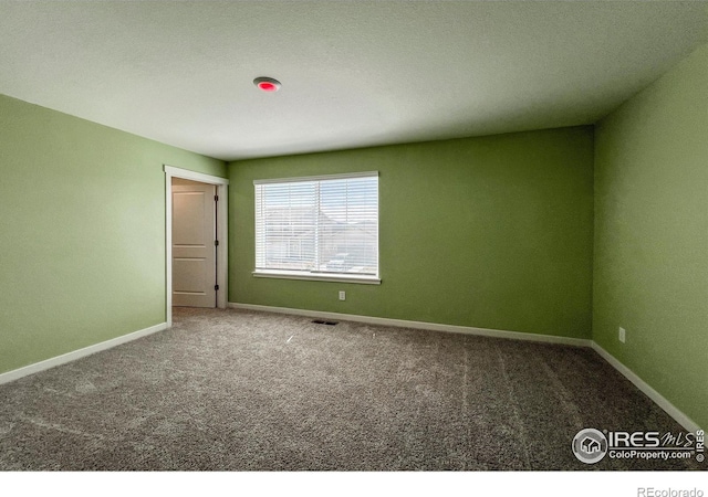 2325 Mountain Sky Dr, Fort Lupton, CO 80621 - carpeted spare room featuring baseboards