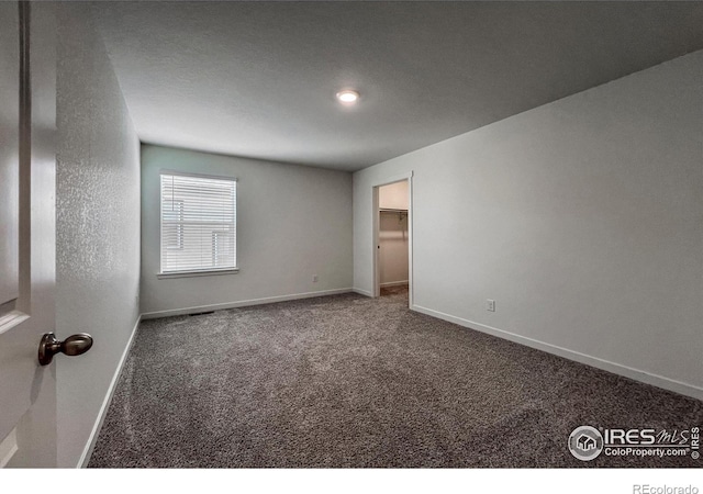 2325 Mountain Sky Dr, Fort Lupton, CO 80621 - carpeted empty room with baseboards