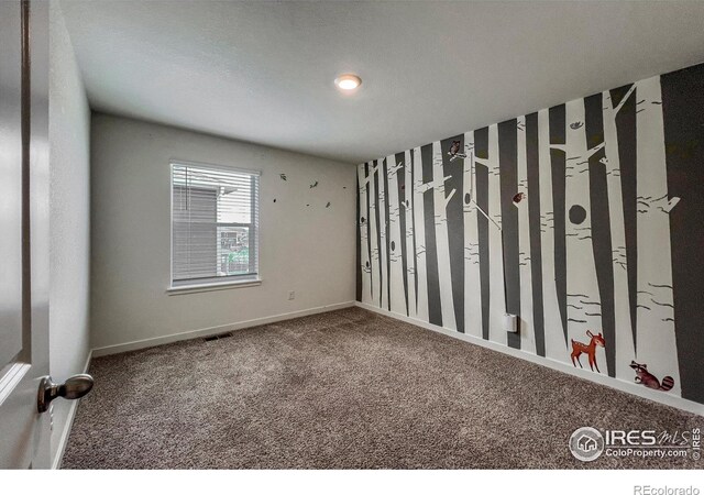 2325 Mountain Sky Dr, Fort Lupton, CO 80621 - unfurnished room featuring carpet floors and baseboards