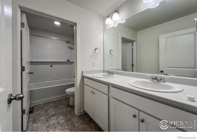2325 Mountain Sky Dr, Fort Lupton, CO 80621 - bathroom featuring double vanity, toilet, and tub / shower combination