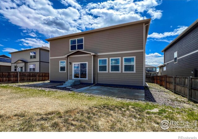 2325 Mountain Sky Dr, Fort Lupton, CO 80621 - back of house featuring a patio area