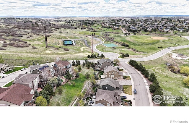birds eye view of property with a residential view