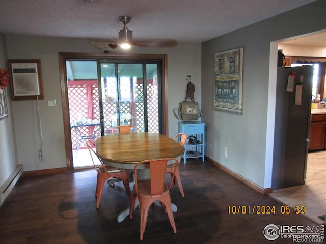 13969 County Road 33, Sterling, CO 80751 - dining space with baseboards, ceiling fan, a wall mounted AC, and baseboard heating