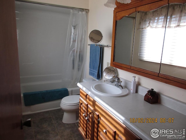 13969 County Road 33, Sterling, CO 80751 - bathroom featuring vanity, tile patterned flooring, shower / bath combo with shower curtain, and toilet