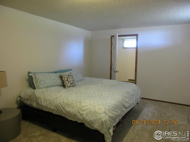 13969 County Road 33, Sterling, CO 80751 - carpeted bedroom featuring a textured ceiling