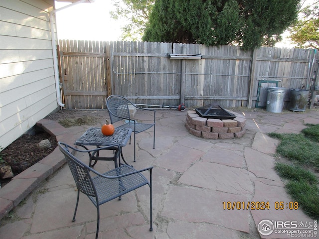 13969 County Road 33, Sterling, CO 80751 - view of patio / terrace with fence and a fire pit