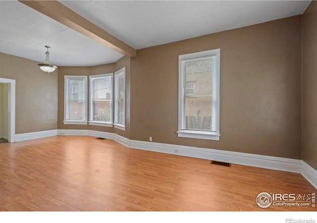 1626 11th Ave, Greeley, CO 80631 - spare room with wood finished floors and baseboards