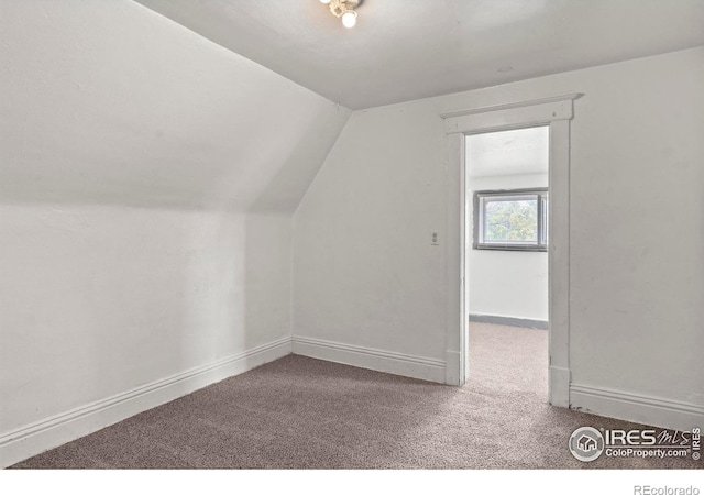 1626 11th Ave, Greeley, CO 80631 - bonus room featuring carpet flooring, lofted ceiling, and baseboards