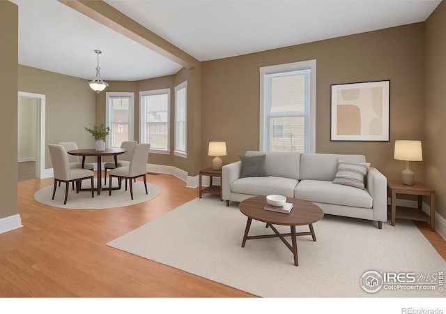 1626 11th Ave, Greeley, CO 80631 - living area with baseboards and light wood-style floors