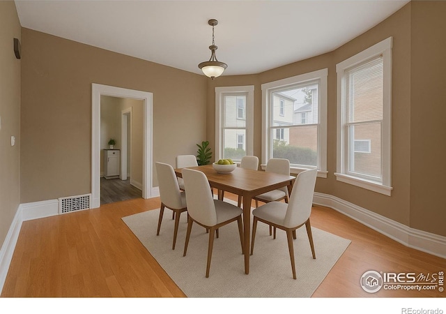1626 11th Ave, Greeley, CO 80631 - dining area with light wood finished floors and baseboards