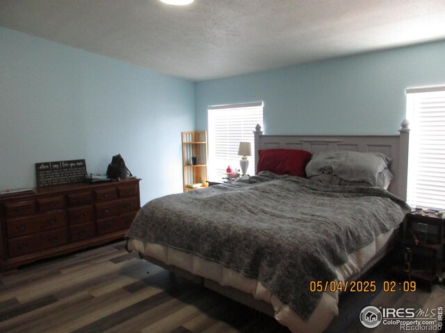 9021 County Road U.5, Weldona, CO 80653 - bedroom with wood finished floors